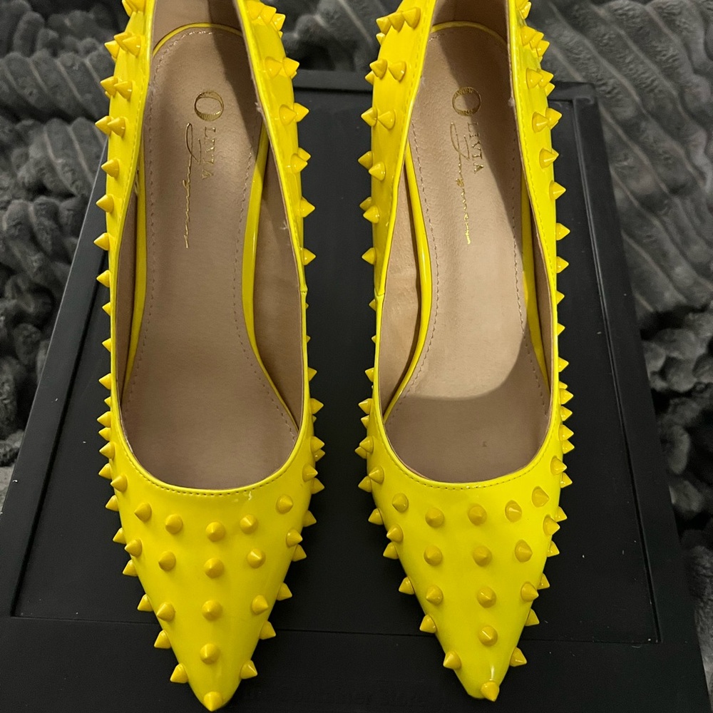 Yellow spiked heels